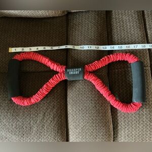 Sharper image resistance band, red, strength training, arms, back, legs therapy.